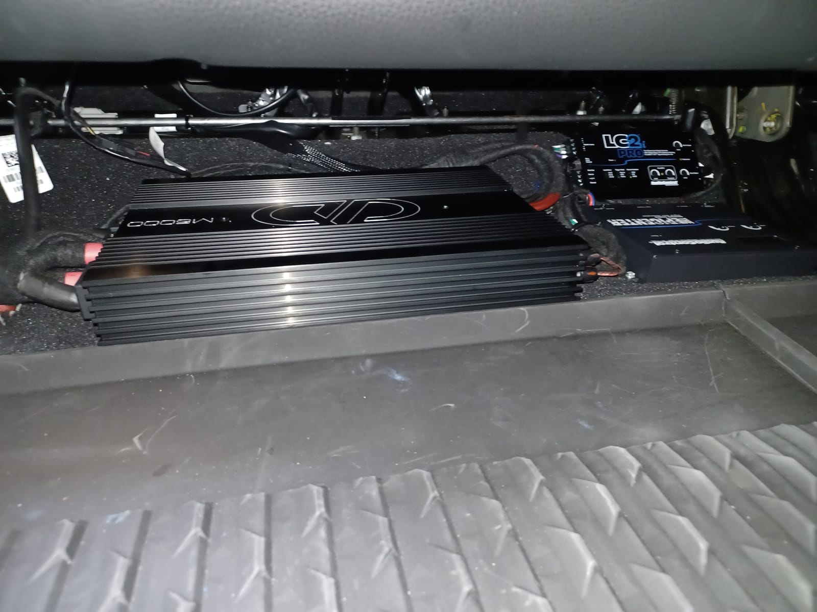 Amplifier and processor install mounted under the seat for a custom car audio system, Escondido