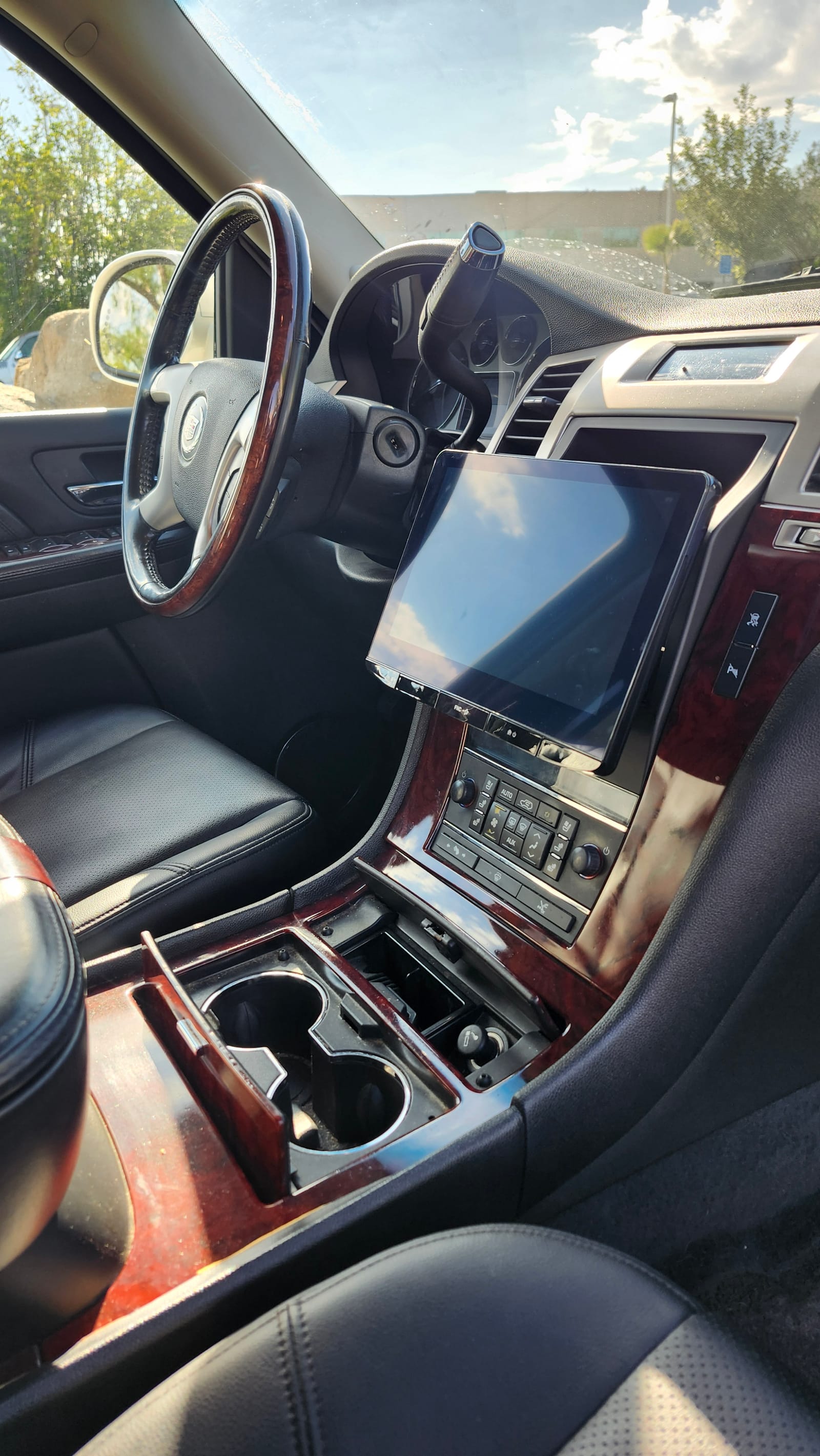 Apple CarPlay tablet integration in a classic car with wood trim, Escondido car audio